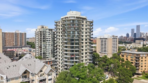 Elevated perspective showcasing a multi-story residential building with tiered balconies - 504 11710 100 Avenue, Edmonton, AB 