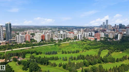 Expansive urban landscape featuring a central green space with mature trees and a golf course - 504 11710 100 Avenue, Edmonton, AB 
