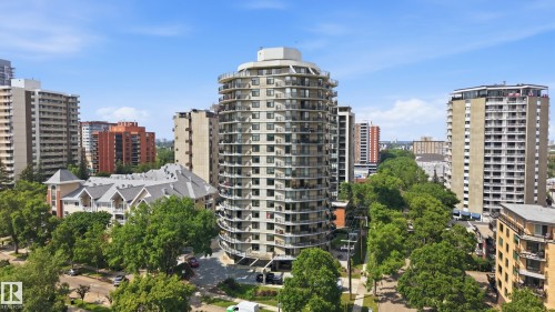 Curved high-rise apartment building featuring multiple private balconies - 504 11710 100 Avenue, Edmonton, AB 
