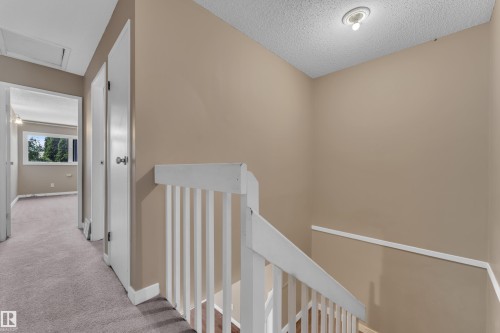 Upper-level hallway with neutral wall paint and light-toned carpet flooring - 6632 36A Avenue, Edmonton, AB 