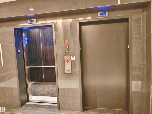 Modern elevator lobby featuring large format tile walls and flooring - 2505 10410 102 Avenue, Edmonton, AB 