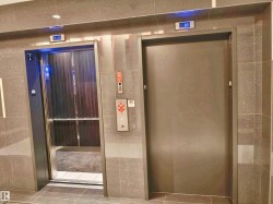 Modern elevator lobby featuring large format tile walls and flooring - 