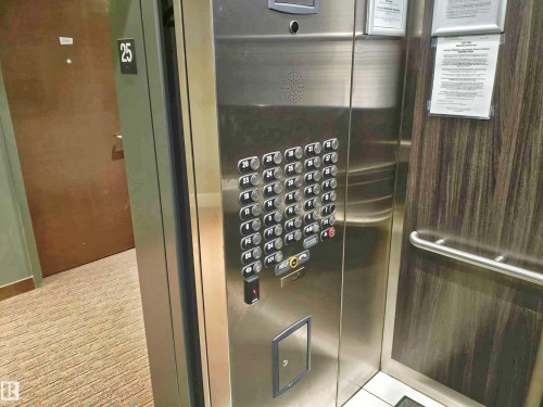 Brushed stainless steel elevator interior featuring a full panel of control buttons - 2505 10410 102 Avenue, Edmonton, AB 