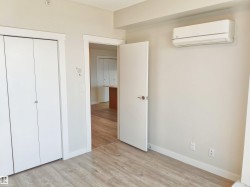 Room featuring light wood-finish flooring, white baseboards, and neutral wall paint - 