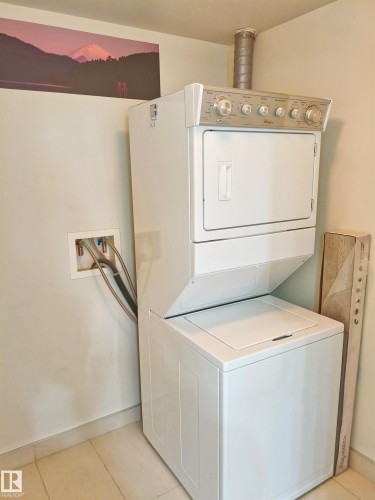 White stackable washer and dryer unit - 2505 10410 102 Avenue, Edmonton, AB 