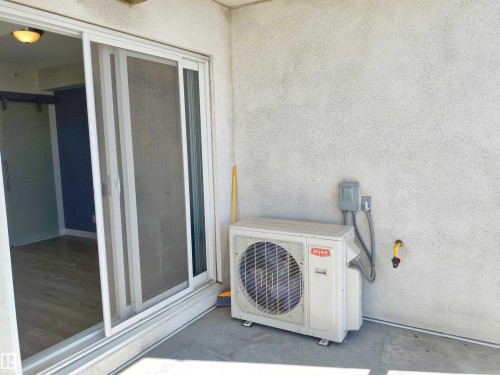 Exterior patio space featuring a concrete surface and textured wall finish - 2505 10410 102 Avenue, Edmonton, AB 