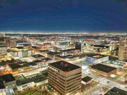 Cityscape with illuminated buildings and expansive urban development - 