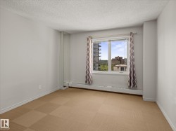 Neutral tone walls with a textured ceiling - 