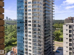 High-rise building with extensive window lines and glass-fronted balconies - 