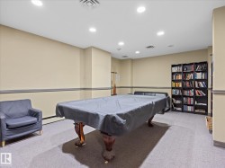 Recreation room featuring a billiards table, recessed lighting, wall-mounted shelving, and carpeted flooring - 