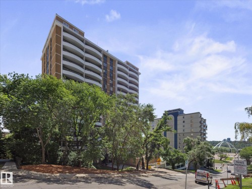 Mid-rise building featuring a brown and white facade with multiple curved balconies - 1601 9725 106 Street, Edmonton, AB 