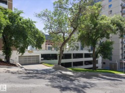 Multi-level parking garage featuring a ground-level entrance with a roll-up door - 