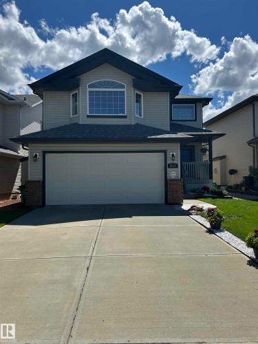 Two-story residence featuring a prominent bay window with an arched transom - 8507 179 Avenue, Edmonton, AB 