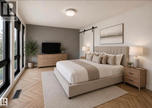 Spacious bedroom with extensive window banks, herringbone wood-finish flooring, and a modern barn door hardware installation - 1304 Rutherford Road, Edmonton, AB 