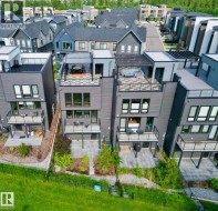 Contemporary multi-story exterior featuring a rooftop deck with a pergola, lower-level balconies, and private patio spaces - 
