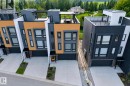 Contemporary townhome exteriors featuring multi-toned siding, integrated garages, and private driveways - 1304 Rutherford Road, Edmonton, AB 