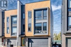 Contemporary exterior featuring a mix of wood-look siding, dark gray stucco, and light brick accents - 