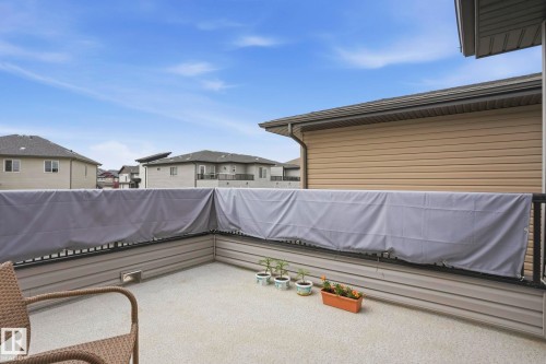 Outdoor balcony featuring concrete flooring, black metal railings, and a privacy screen - 4320 Annett Common, Edmonton, AB - Outdoor With Exterior
