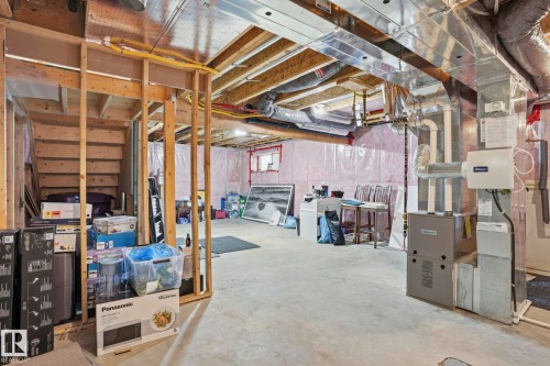 Unfinished basement area featuring a concrete floor and exposed wood framing - 4320 Annett Common, Edmonton, AB - Indoor Photo Showing Basement