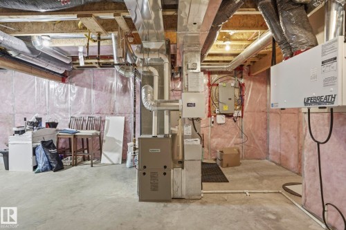 Unfinished basement area featuring a concrete floor, exposed wood ceiling joists, and insulated perimeter walls - 4320 Annett Common, Edmonton, AB - Indoor Photo Showing Basement