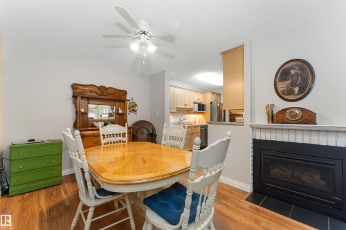 Dining area with wood-finish flooring and a ceiling fan - 5802 172 Street, Edmonton, AB 