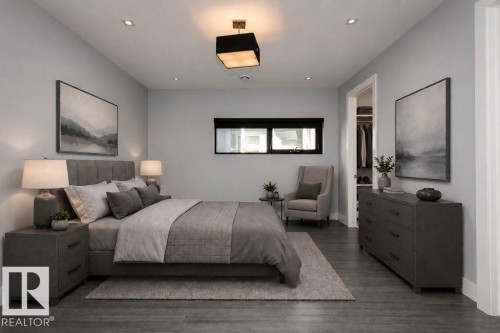 Spacious sleeping area featuring wood-finish flooring and light gray walls - 9035 Saskatchewan Drive, Edmonton, AB 