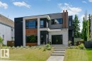 Contemporary facade featuring a multi-material exterior with light stone accents, dark paneling, wood-finish siding, and broad window placements - 9035 Saskatchewan Drive, Edmonton, AB 