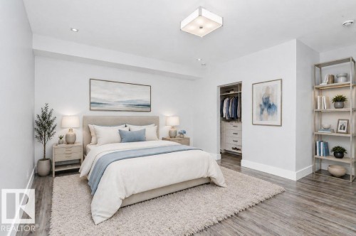 Spacious room featuring light wood-finish flooring and recessed lighting - 9035 Saskatchewan Drive, Edmonton, AB 