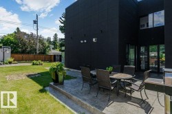 Expansive rear patio area featuring a concrete surface - 