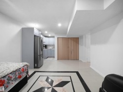 Spacious interior featuring tile flooring with a decorative inlay - 