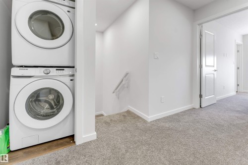 Integrated laundry area featuring stacked appliances - 788 Mattson Drive, Edmonton, AB 