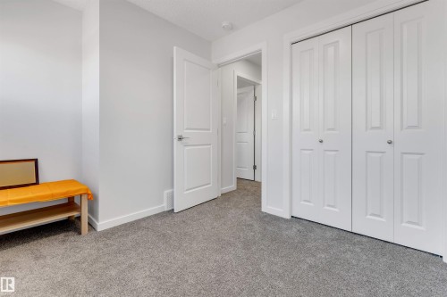 Plush grey carpeting complements the light-toned walls - 788 Mattson Drive, Edmonton, AB 