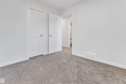 Plush gray carpet flooring paired with crisp white walls and baseboards - 788 Mattson Drive, Edmonton, AB 