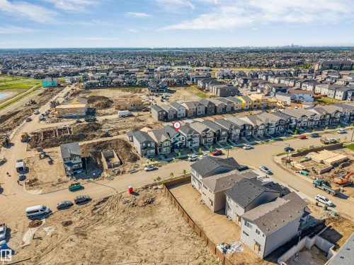 Aerial perspective showcasing a residential development with a mix of completed and under-construction homes - 788 Mattson Drive, Edmonton, AB 