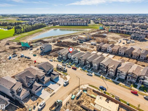 Aerial perspective of a developing residential area featuring multiple newly constructed homes with varied architectural styles - 788 Mattson Drive, Edmonton, AB 