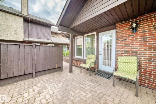 Brick paver patio area with a privacy fence - 7930 111 Street, Edmonton, AB - Outdoor With Deck Patio Veranda With Exterior