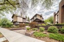 Contemporary exterior featuring a combination of stucco and dark siding, pitched rooflines, and prominent chimneys - 7930 111 Street, Edmonton, AB  - Outdoor 