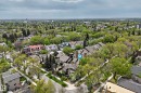 Aerial perspective of a tree-lined residential area featuring multiple housing styles and established greenery - 7930 111 Street, Edmonton, AB  - Outdoor With View 