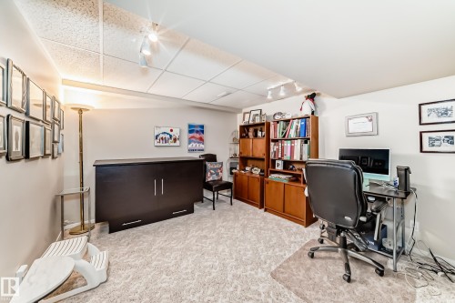 All FURNITURE in this room can be included -- Hide-a bed; shelving unit; computer, desk, & chair; T.V. & stand; - 7930 111 Street, Edmonton, AB - Indoor Photo Showing Office