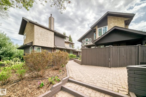 Contemporary architecture featuring stone and siding exterior finishes - 7930 111 Street, Edmonton, AB - Outdoor With Exterior