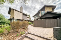 Contemporary architecture featuring stone and siding exterior finishes - 