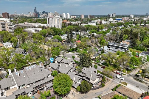 Aerial perspective showcasing a residential development with multiple units, each featuring a pitched shingle roof - 7930 111 Street, Edmonton, AB - Outdoor With View