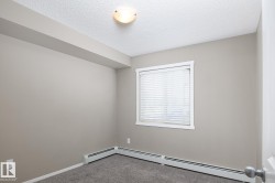 Neutral-toned walls complement the textured ceiling - 