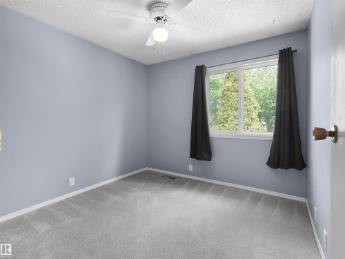 Room featuring light gray walls and coordinating gray carpet - 16 13833 30 Street, Edmonton, AB 