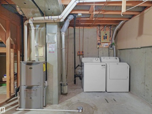 Utility area featuring a furnace, water heater, washer, and dryer - 16 13833 30 Street, Edmonton, AB 
