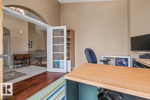 Room featuring a wood-finish floor and neutral wall paint - 215 Westerra Point(E), Stony Plain, AB 