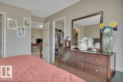 Primary Bedroom with Walk-In Closet and Ensuite - 6042 214 Street, Edmonton, AB - Indoor Photo Showing Bedroom
