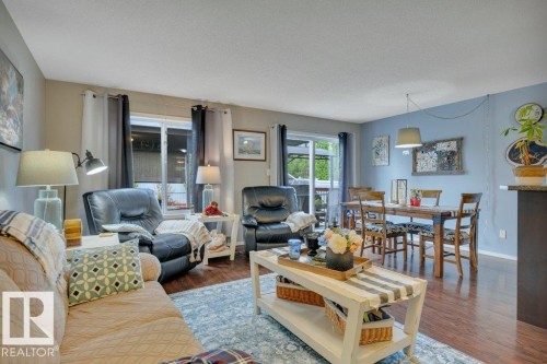 Open concept living area with engineered hardwood - 6042 214 Street, Edmonton, AB - Indoor Photo Showing Living Room