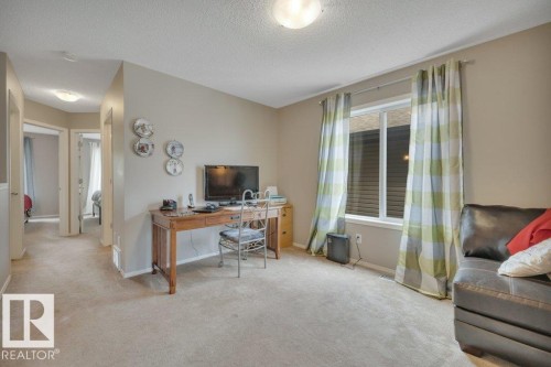 Carpeted room with neutral wall tones and a single window - 6042 214 Street, Edmonton, AB - Indoor