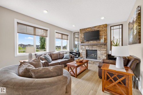 3803 48 Avenue, Beaumont, AB - Indoor Photo Showing Living Room With Fireplace